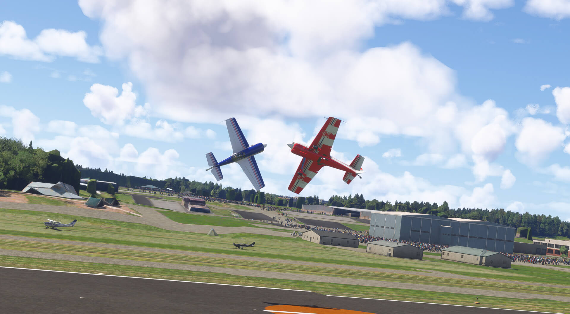 Two aircraft perform knife edge opposing passes at an airshow