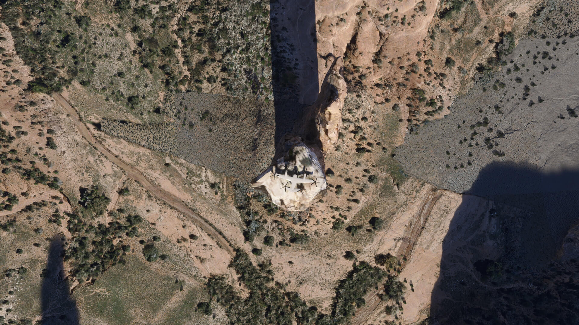 A screenshot from motheryVase665 (Forums) showing an eVTOL aircraft landing atop a rocky spire
