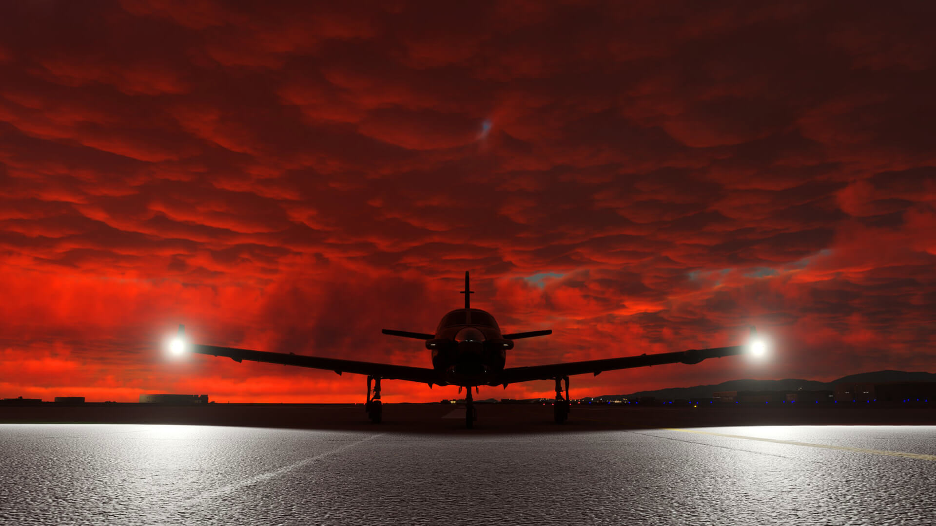 A silhouetted propeller aircraft with overcast clouds above being lit by the sunset