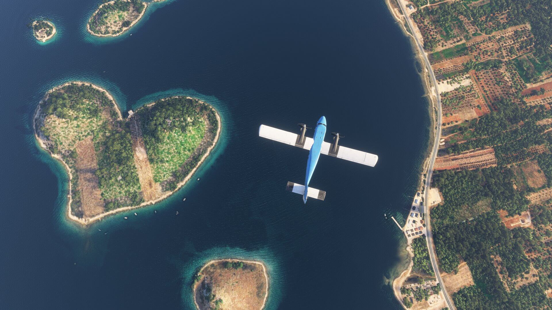 A Twin Otter flies above an island formed in the shape of a heart