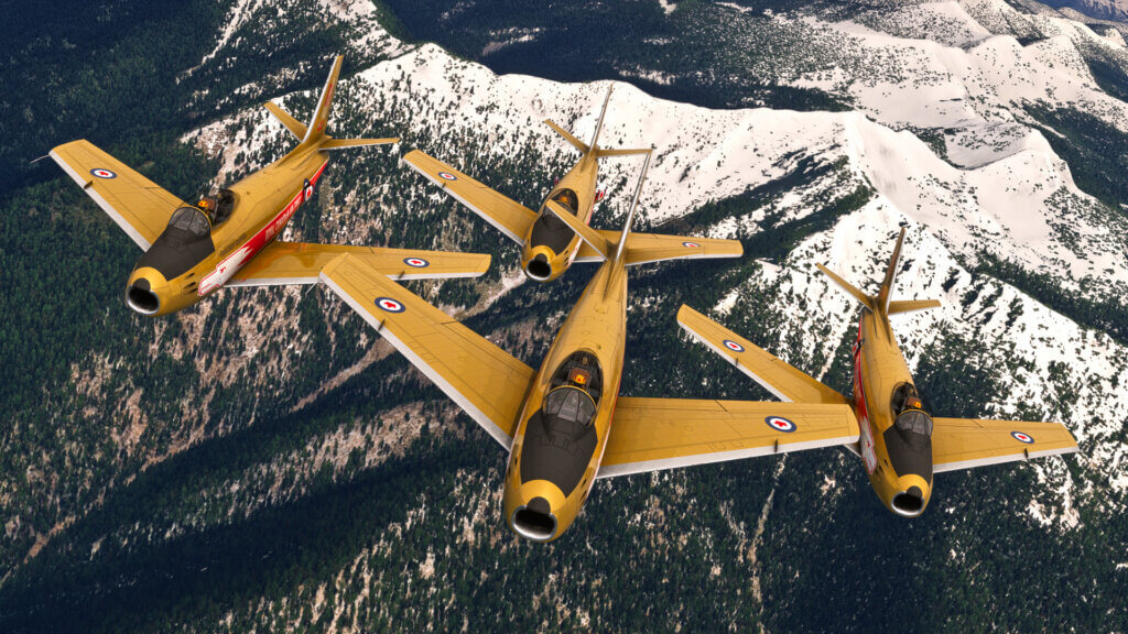 Four yellow military jets fly in close formation