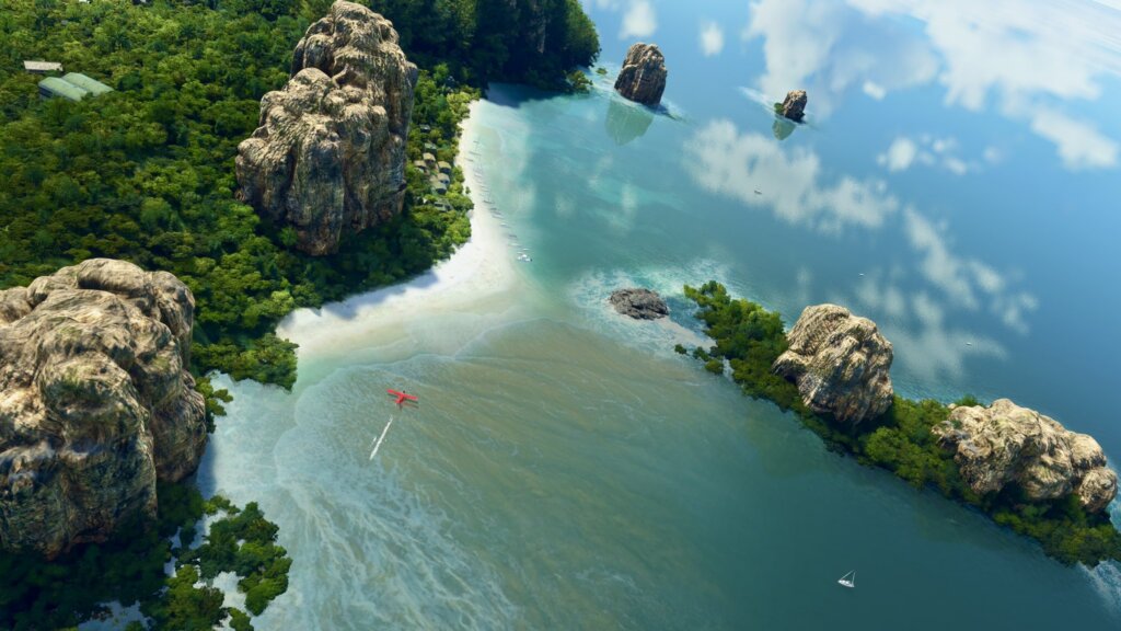 A red propeller aircraft lands on water