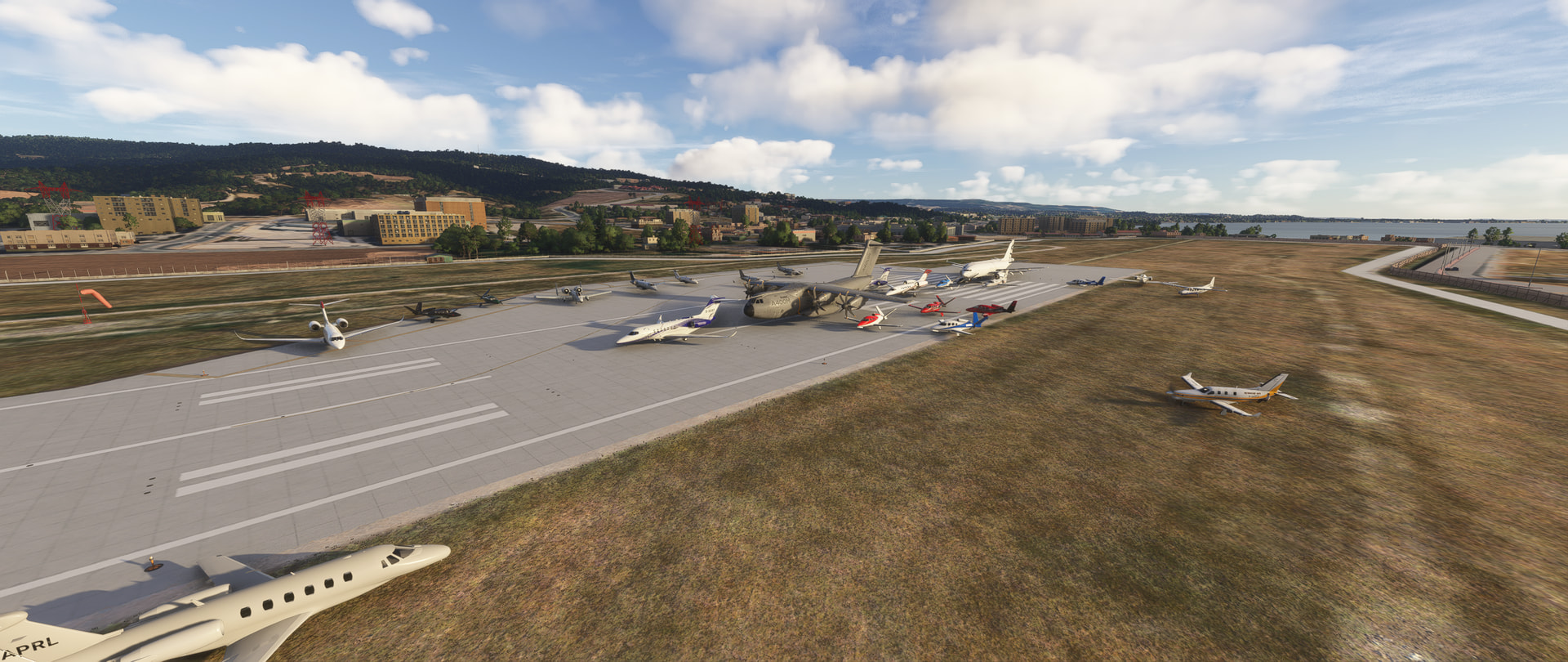 A group of aircraft at the threshold of a runway