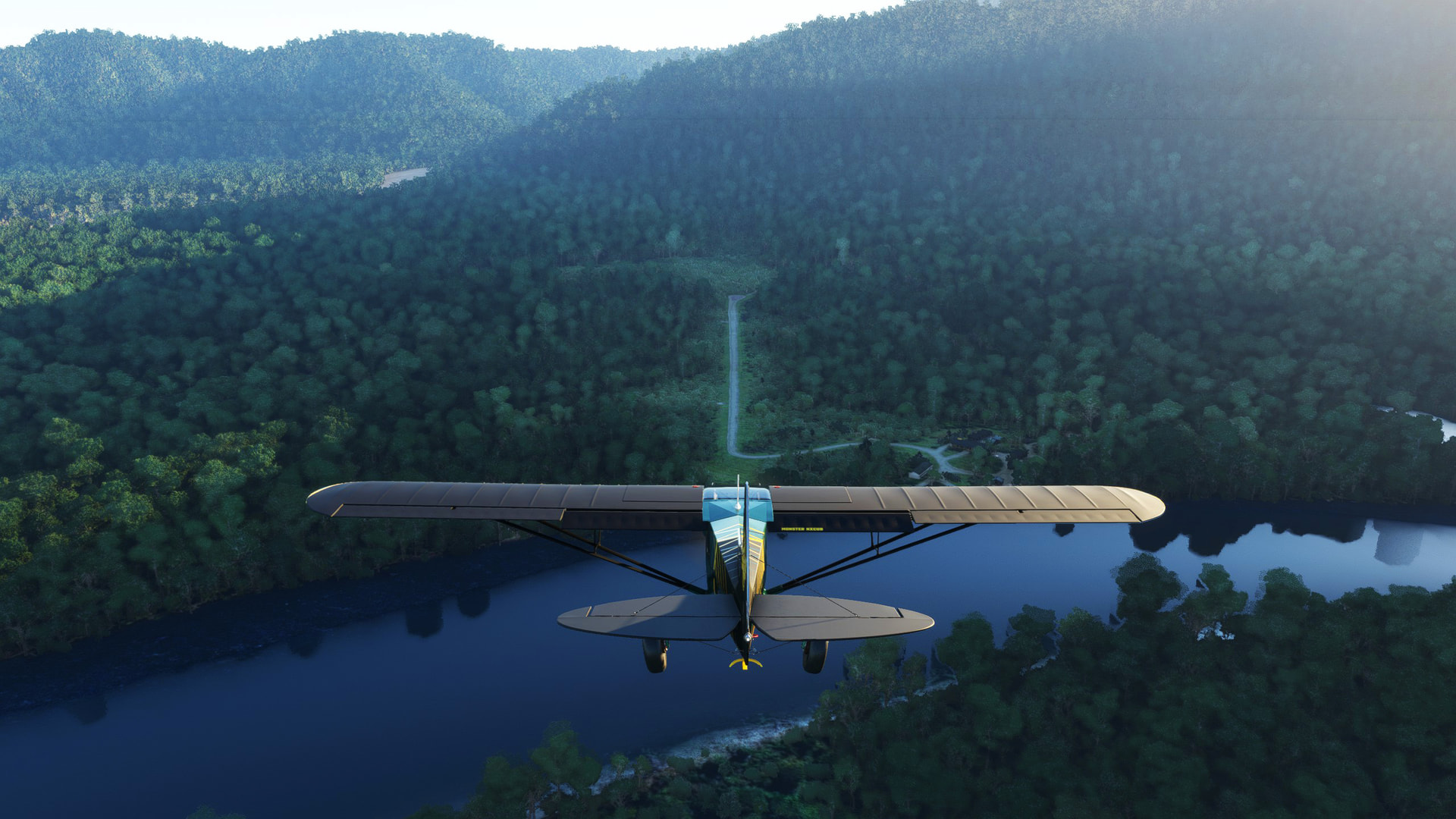 A high wing propeller aircraft lines up with a narrow runway in amongst a forest