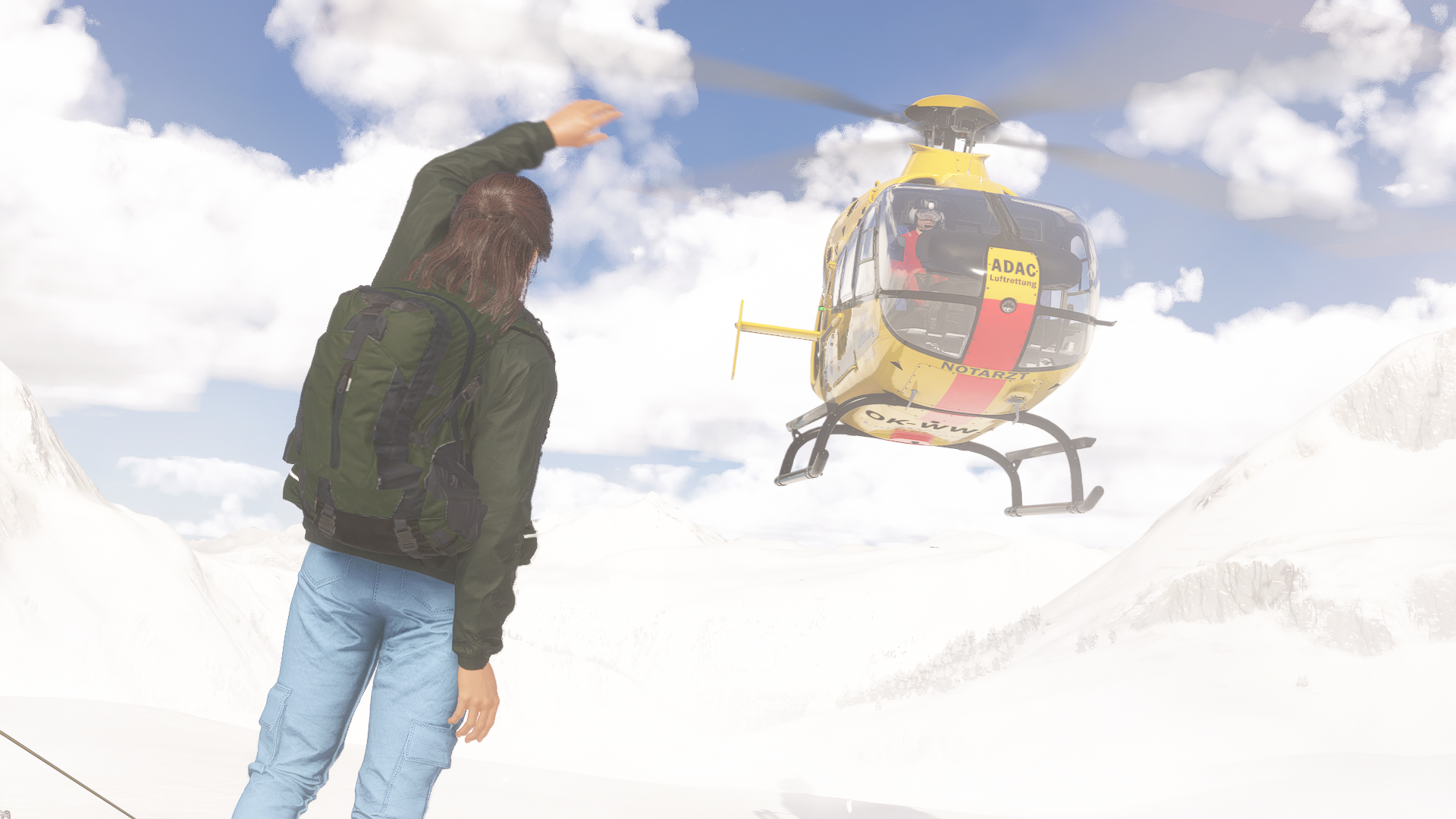 A yellow helimed hovers above a stranded hiker on a snowy mountain