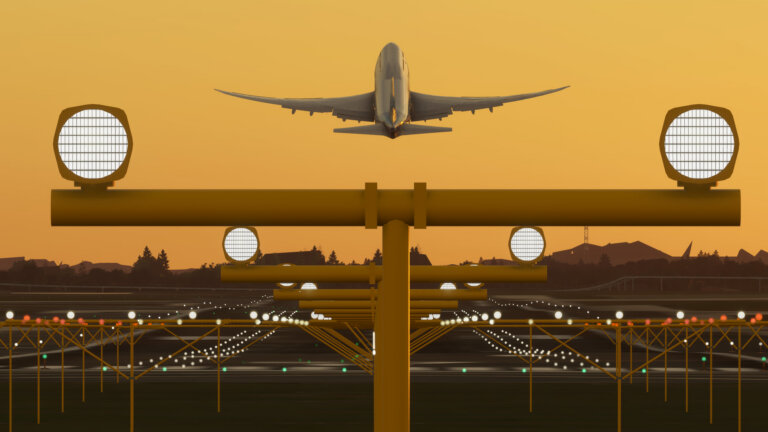 A view down the runway with a Boeing 747 rotating on take off