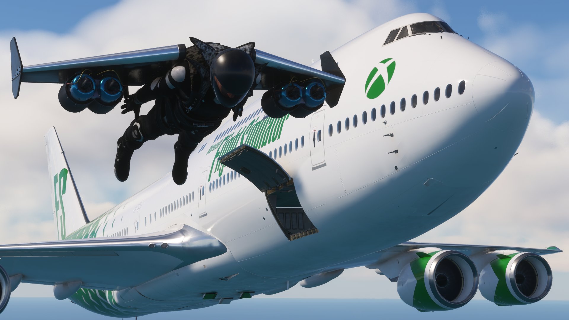 A Boeing 747 flies next to a stunt performer in a jet-powered wing suit