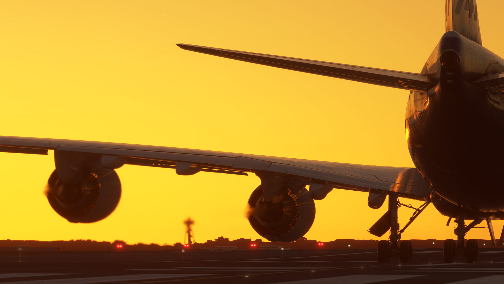 The silhouette of a Boeing 747 during golden hour