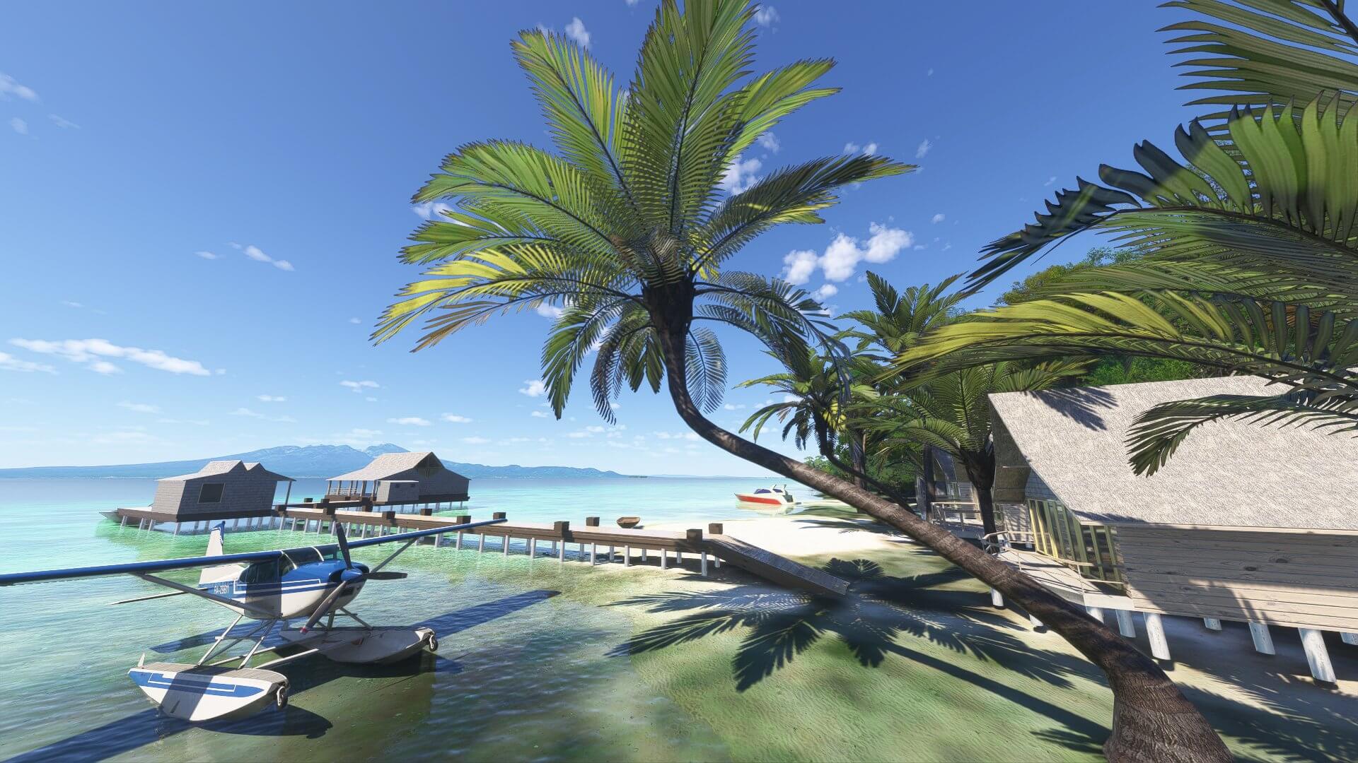 A water float aircraft sits idle next to a jetty on a tropical island