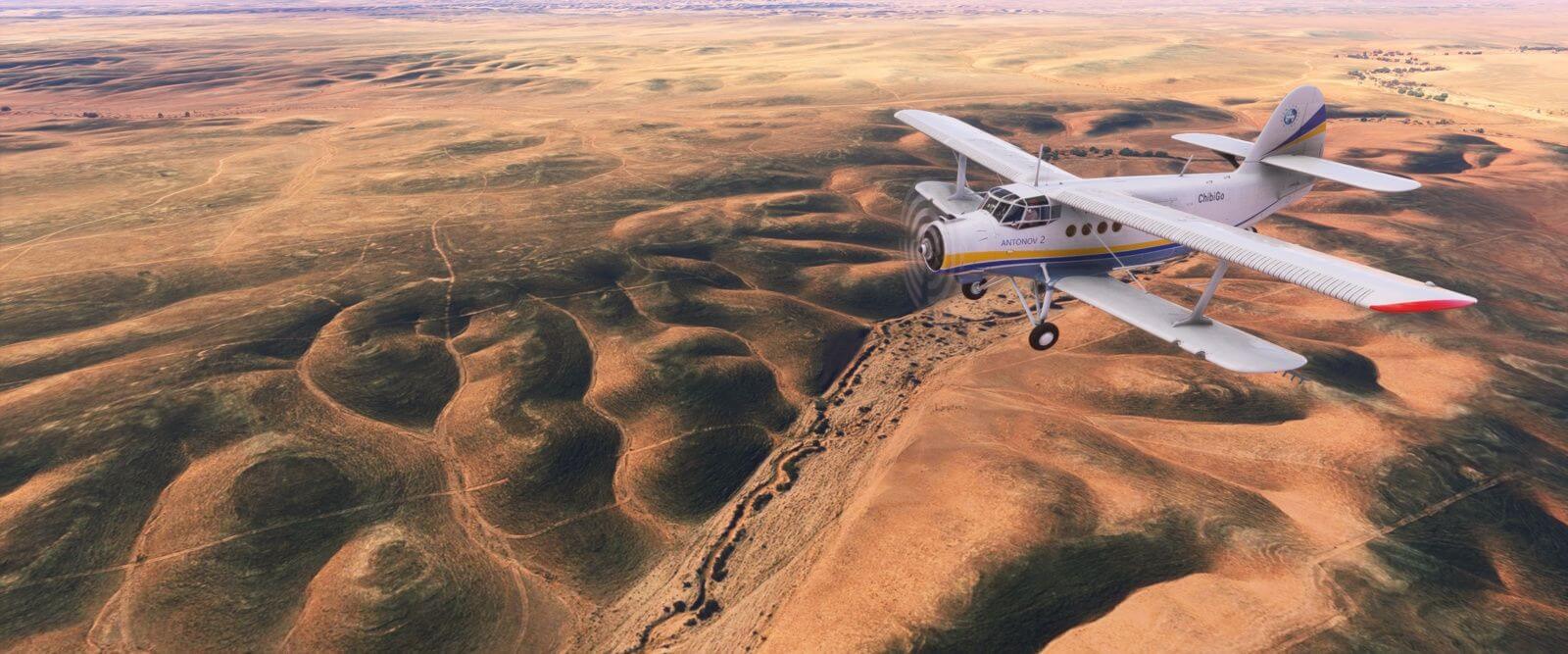An Antonov AN-2 cruising over a desert