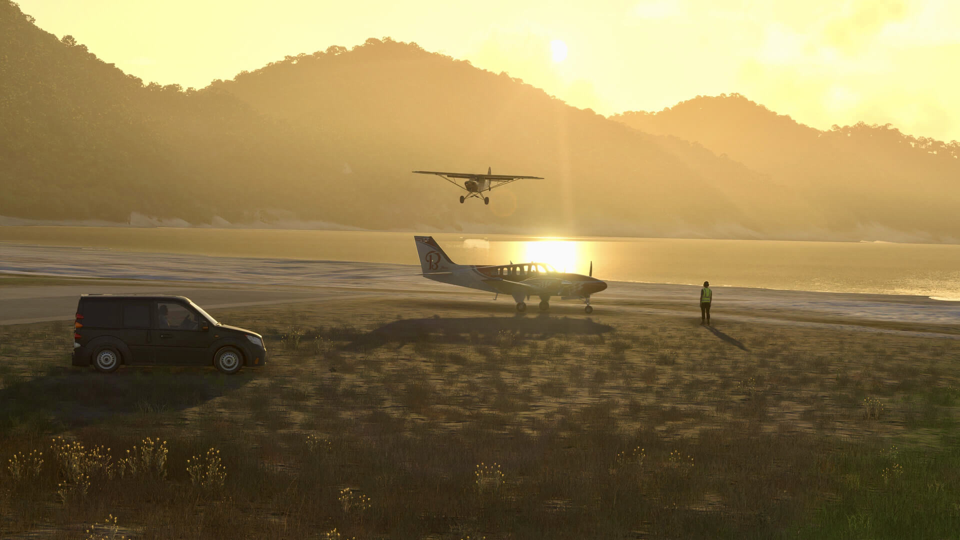 A high wing aircraft flies towards a Beechcraft during sunset