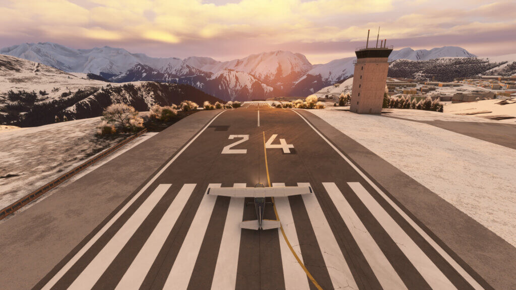 A high-wing propeller aircraft lines up for takeoff from Courchevel airport