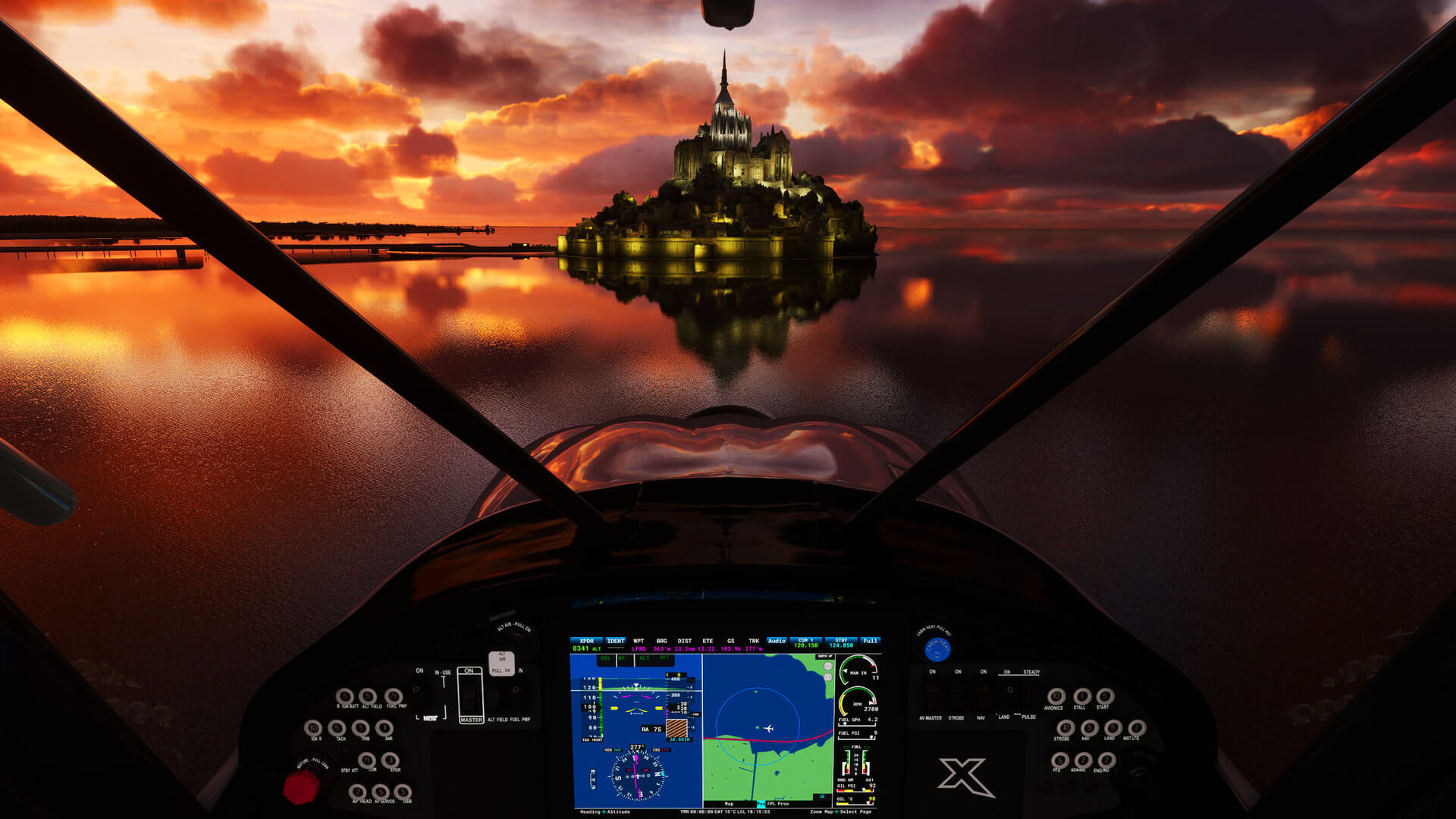 An X Craft flies towards Mont Saint-Michel during sunset
