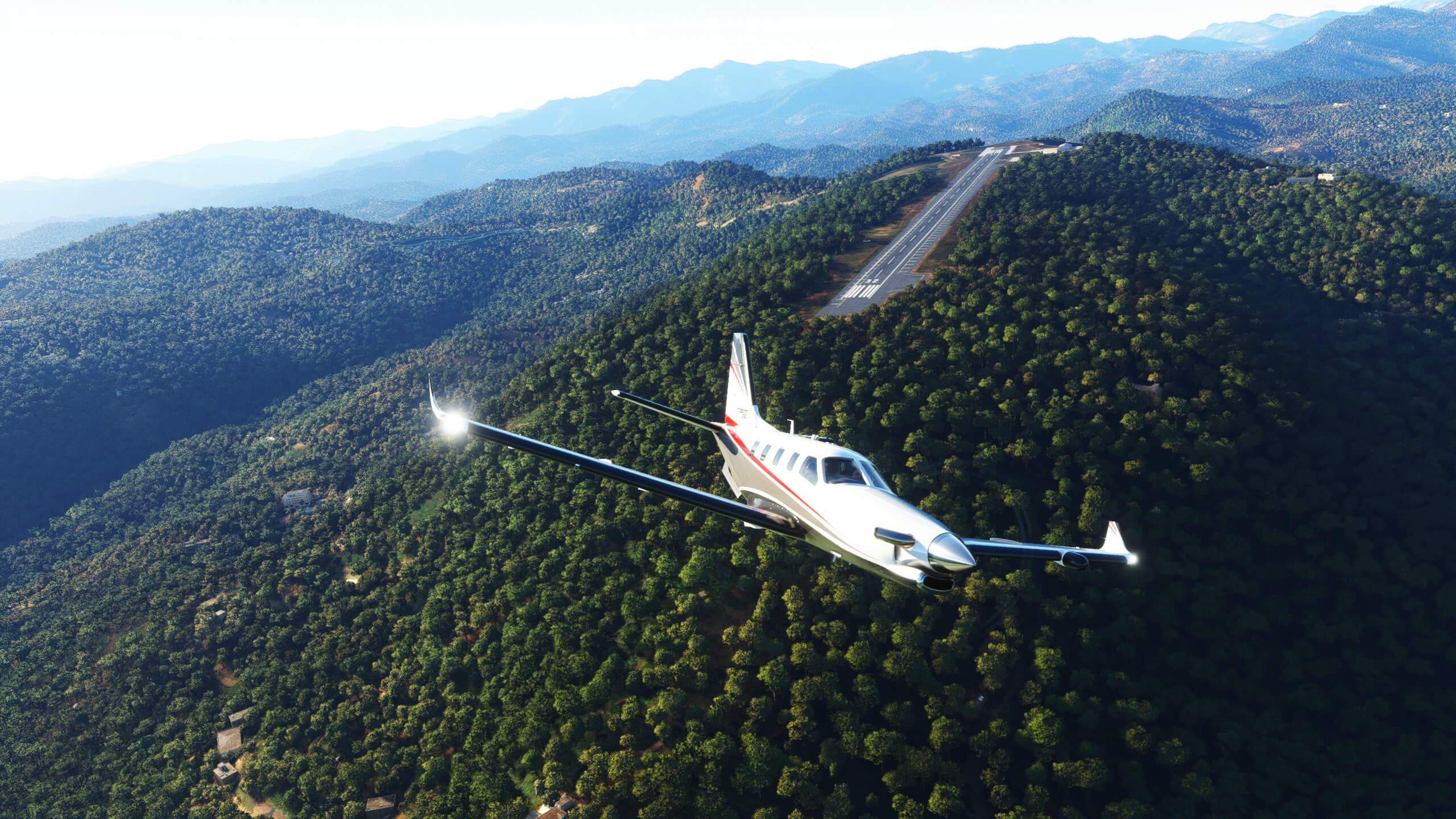 A TBM 930 departing from a runway located on a hill top