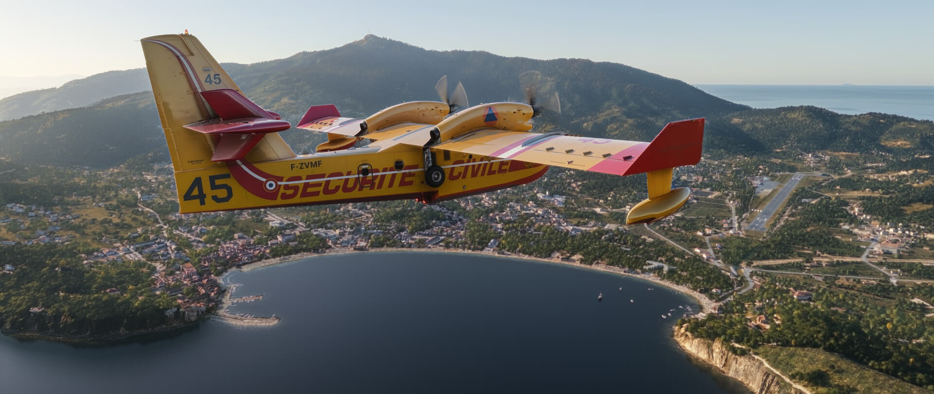A CL-415 fire fighting aircraft flies over an island