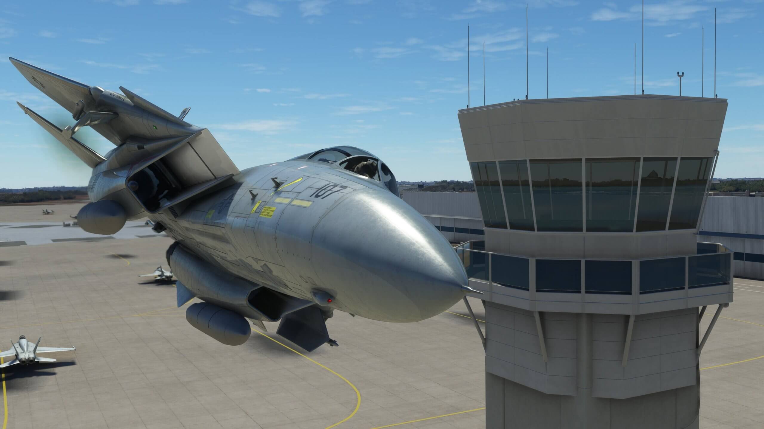 An F-14 buzzes the tower with a close fly-by